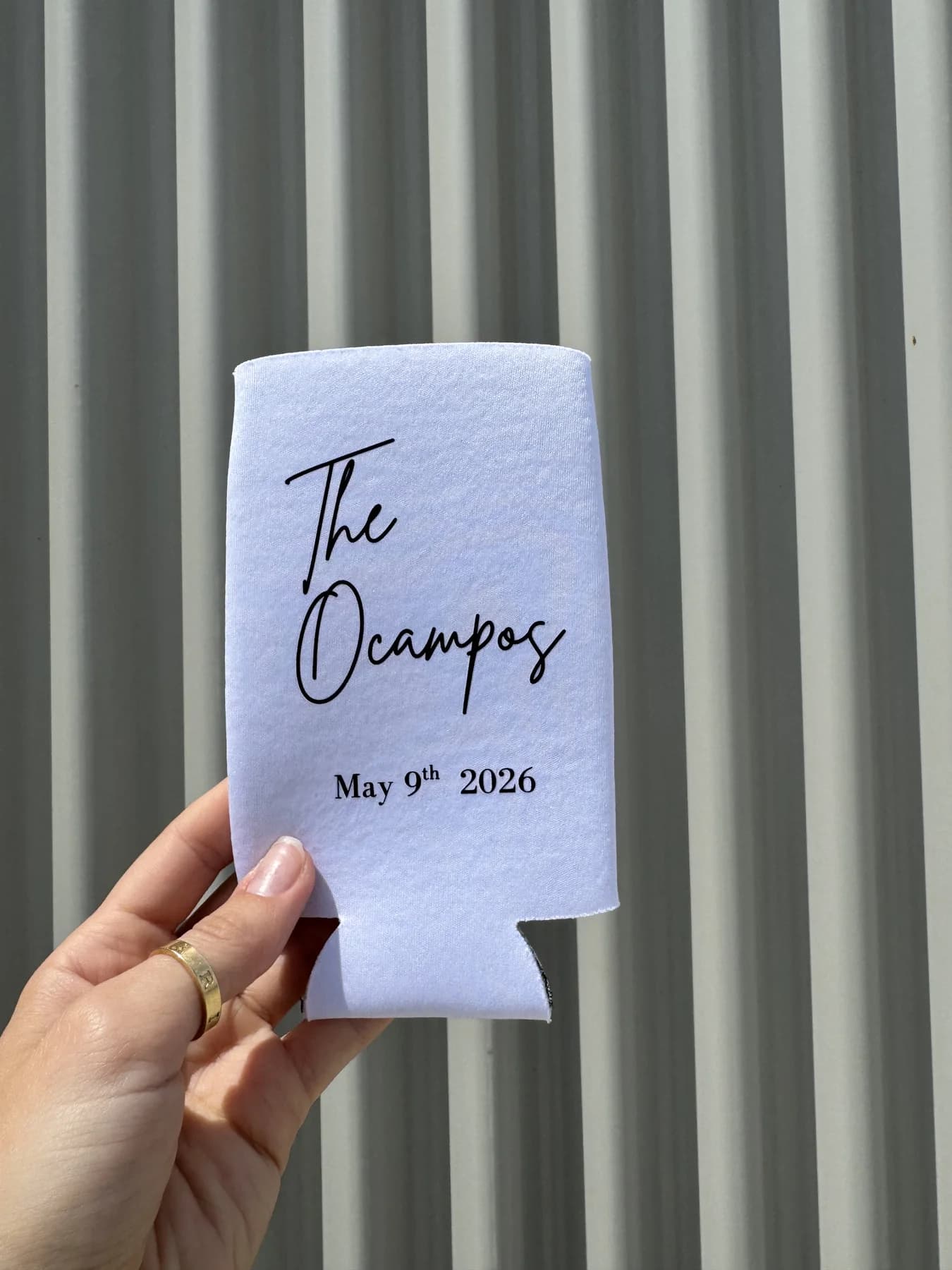 White custom wedding koozie for The Ocampos held outdoors