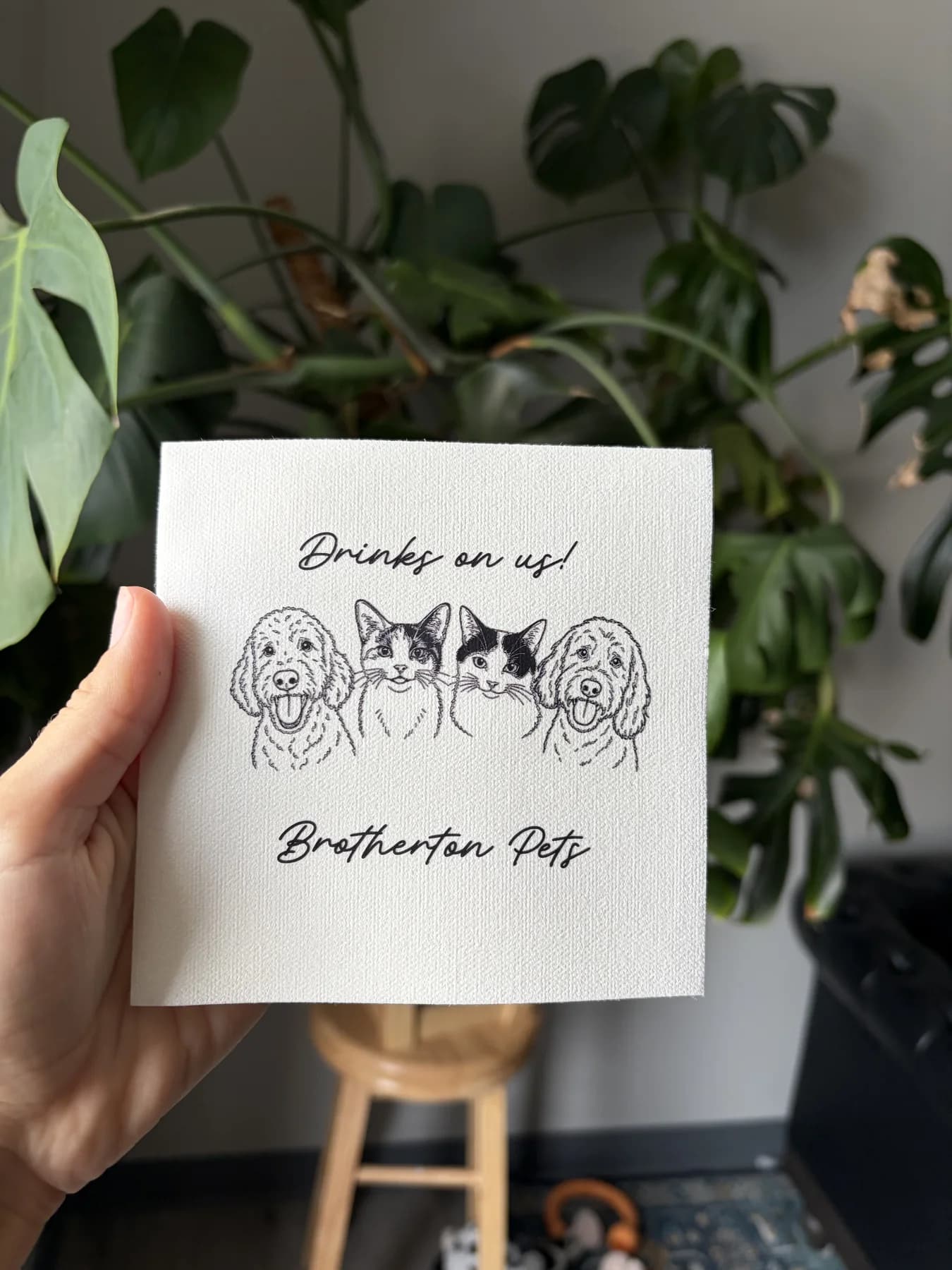 Personalized cocktail napkin with illustrated pet portraits