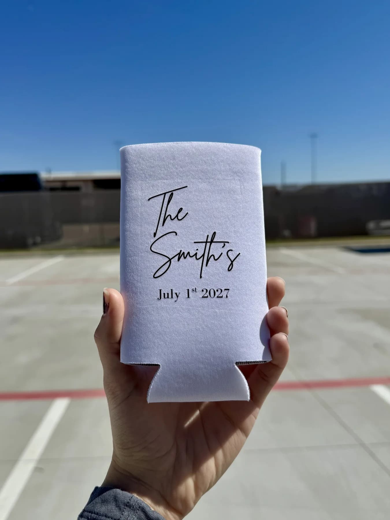 White custom wedding koozie for The Smiths held outdoors